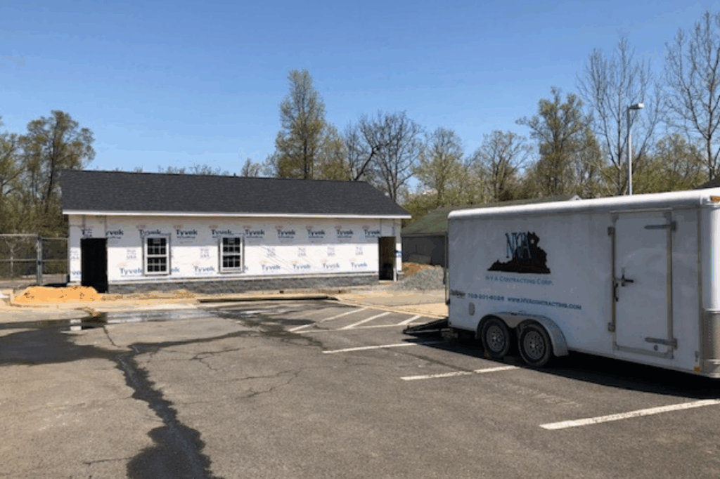 Construction company new construction with work trailer