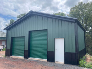 Exterior view of a commercial steel-frame warehouse building after construction, showing the completed warehouse.